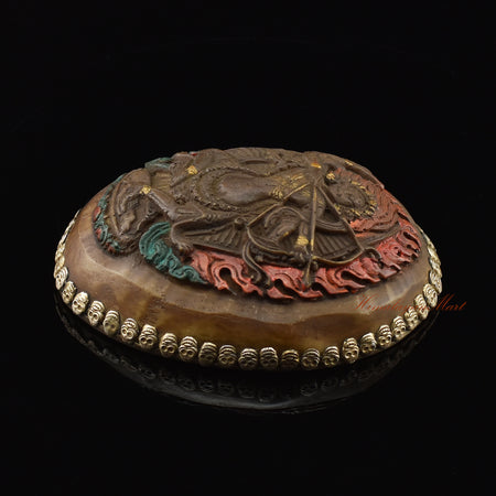 Right side view of the Kurukulla Carved Resin Kapala showing silver-plated copper detailing and skull motifs