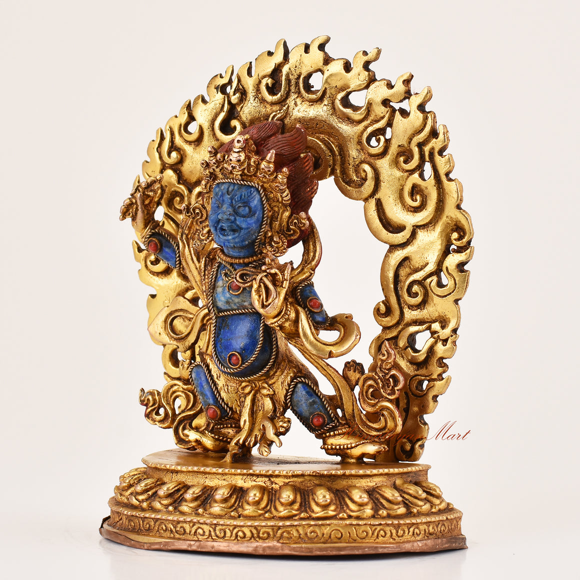 Left side profile of lapis inlay Vajrapani statue showing detailed copper alloy craftsmanship and traditional Tibetan Buddhist artistry.