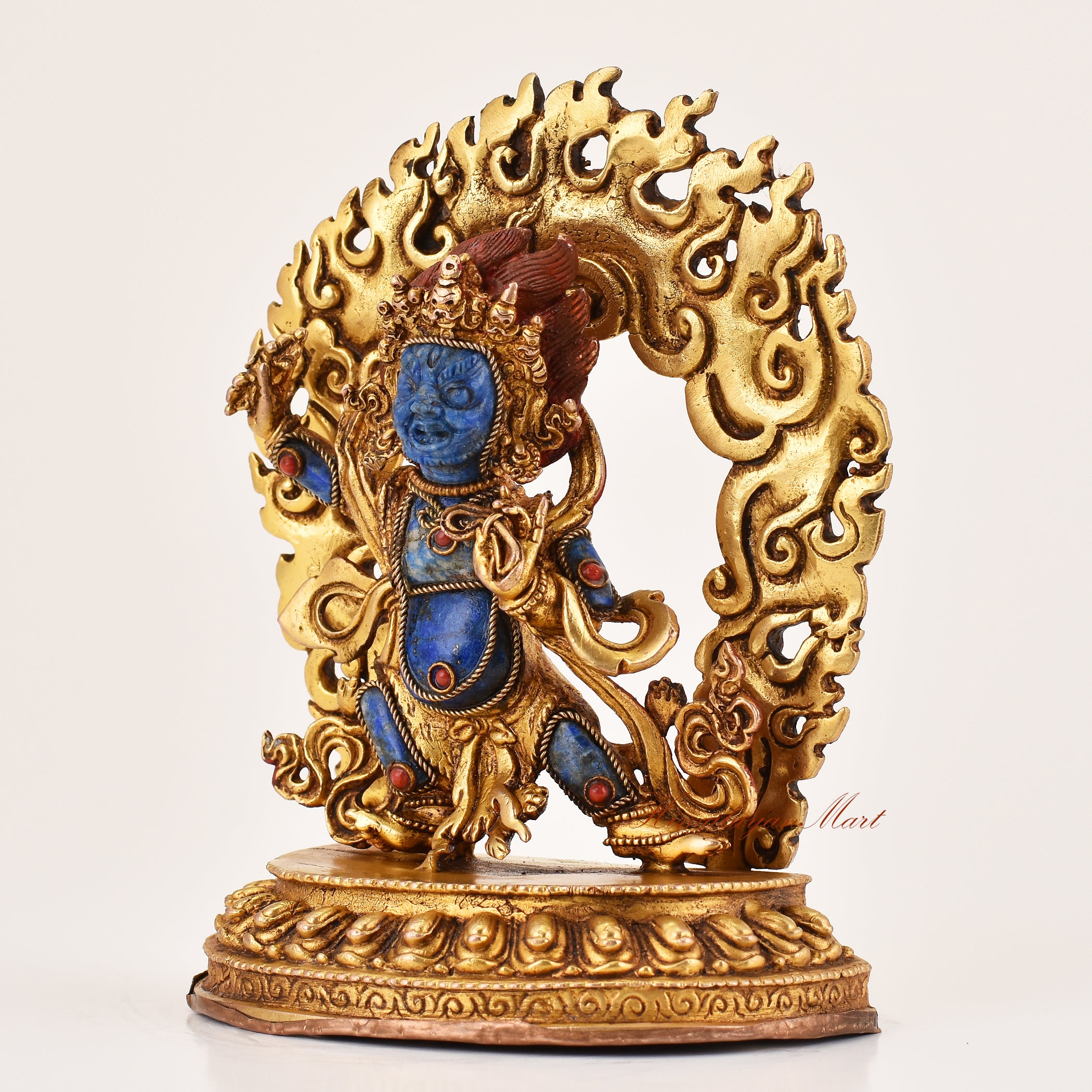 Left side profile of lapis inlay Vajrapani statue showing detailed copper alloy craftsmanship and traditional Tibetan Buddhist artistry.