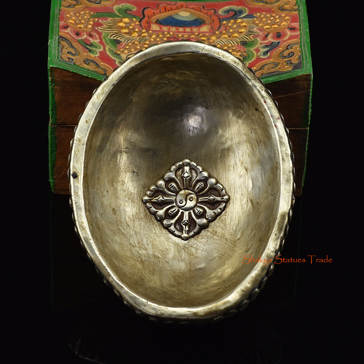 Back view of the Mahakali Carved Resin Kapala showing delicate skull motifs