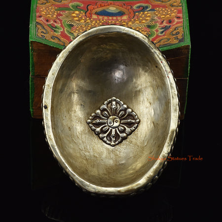 Back view of the Mahakali Carved Resin Kapala showing delicate skull motifs