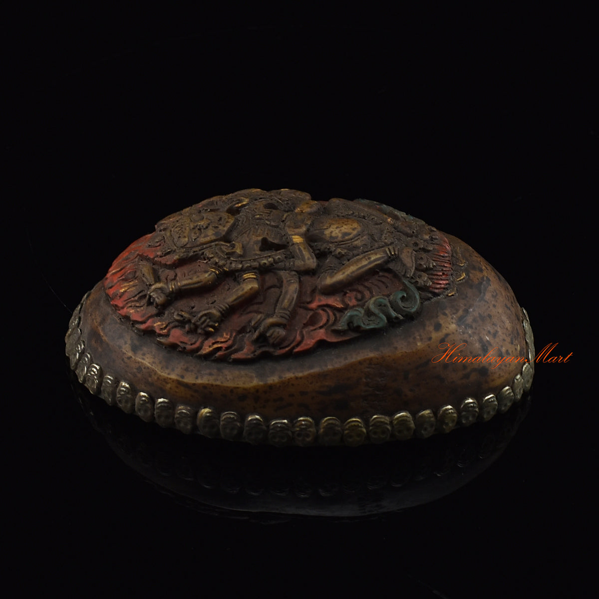 Left side view of the Mahakali Carved Resin Kapala with hand-painted skull cup design