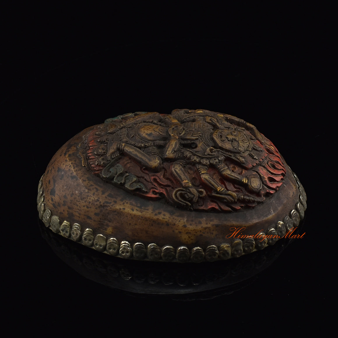 Right side view of the Mahakali Carved Resin Kapala showing silver-plated copper detailing