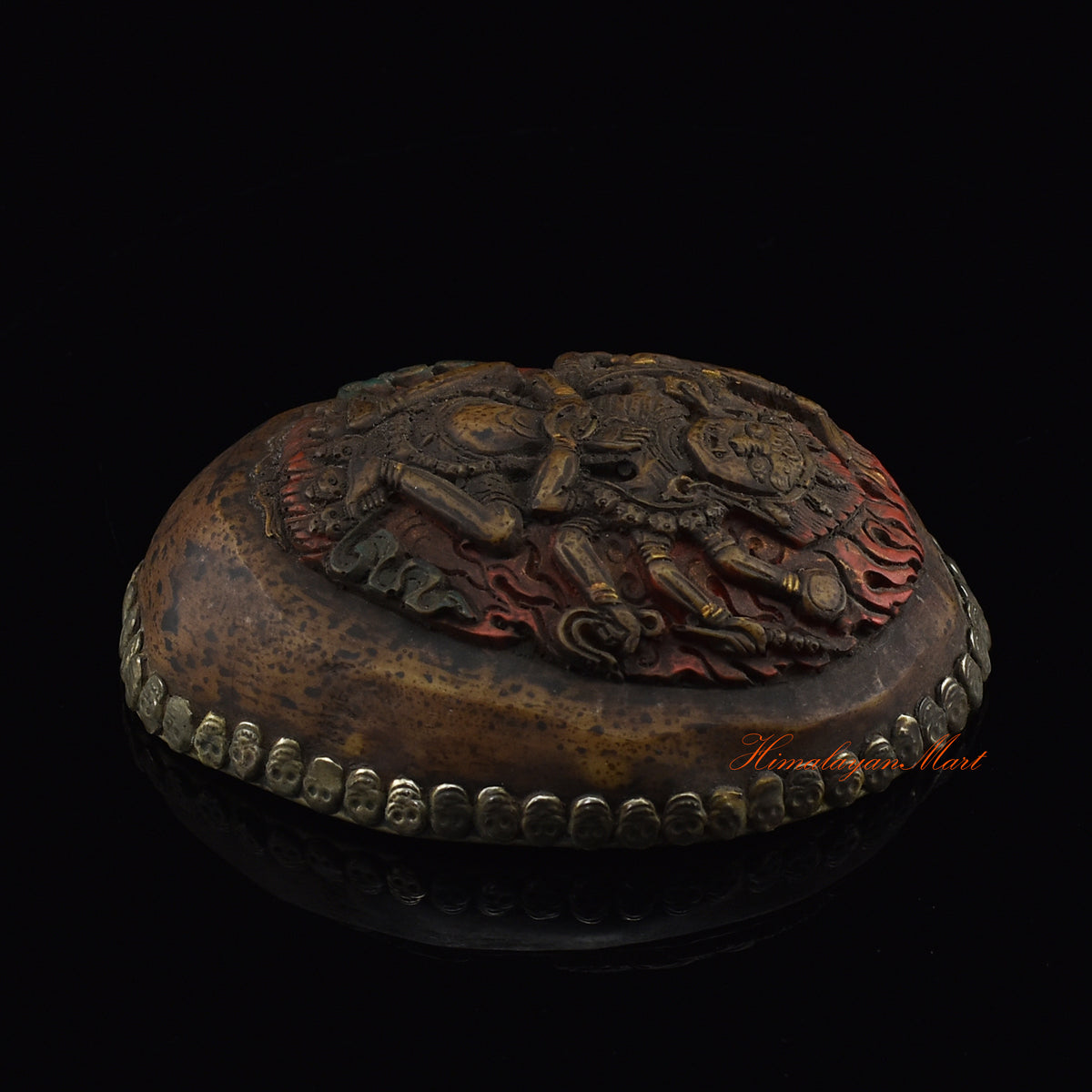 Right side view of the Mahakali Carved Resin Kapala showing silver-plated copper detailing