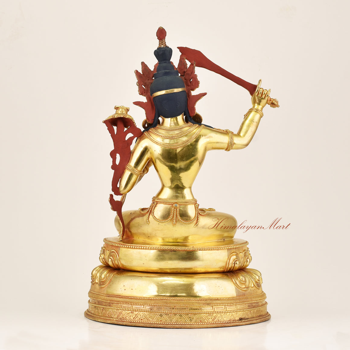 Back view of Manjushri Buddha Statue showing lotus throne and hand-carved robe detailing