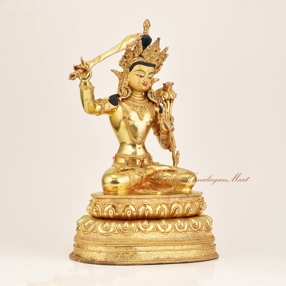 Right side view of Manjushri Buddha Statue showing copper alloy casting and gold gilding detail