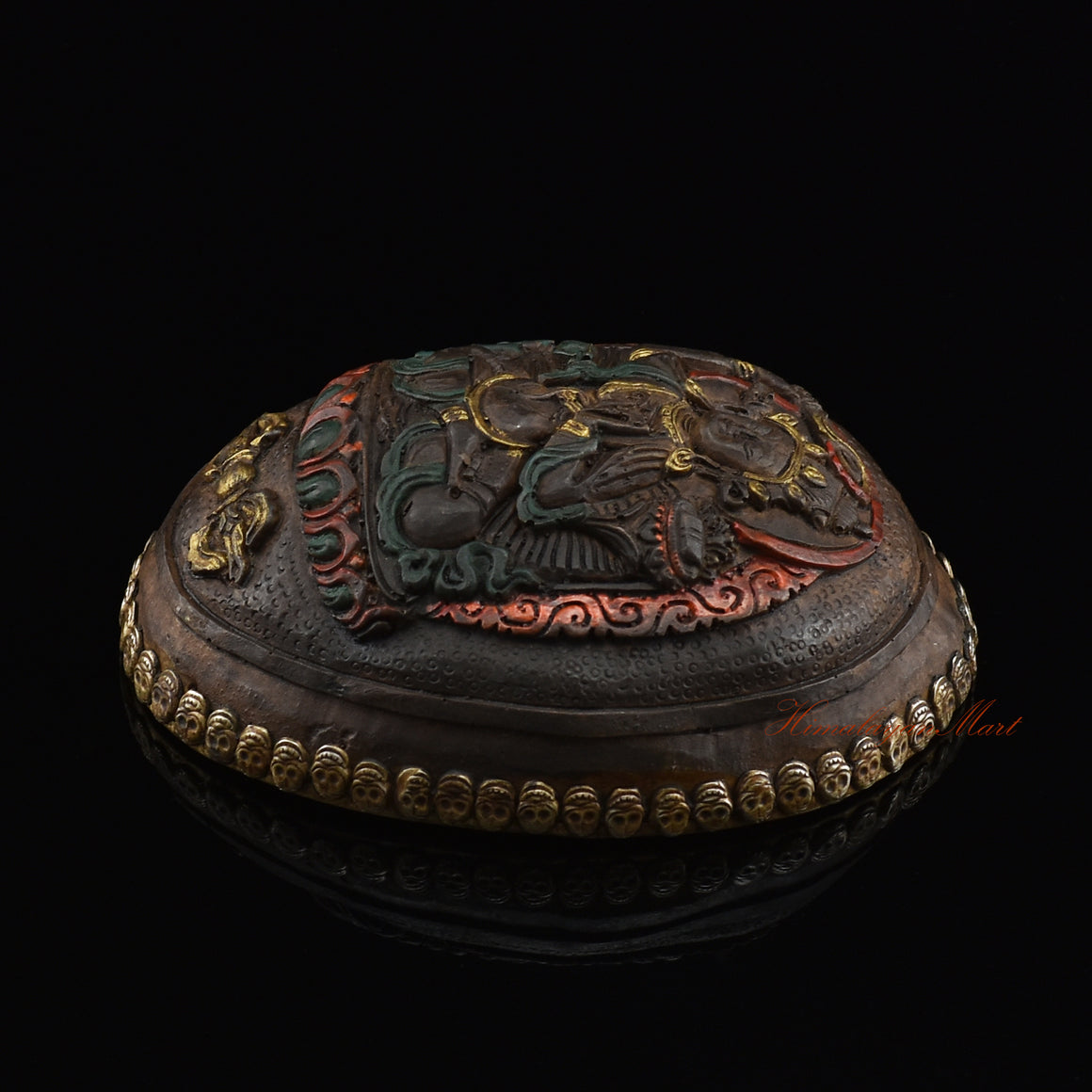 Right side view of the Manjushri Carved Resin Kapala showing the hand-painted finish and skull border