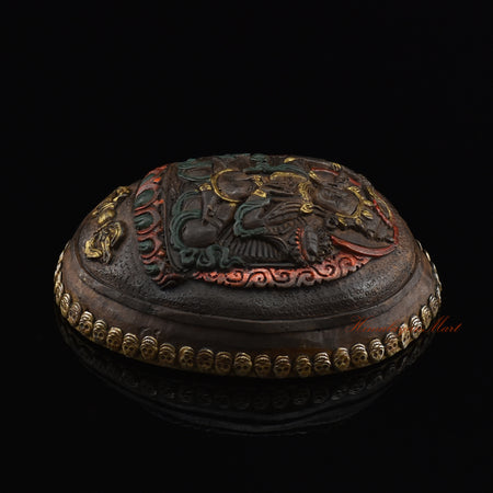 Right side view of the Manjushri Carved Resin Kapala showing the hand-painted finish and skull border
