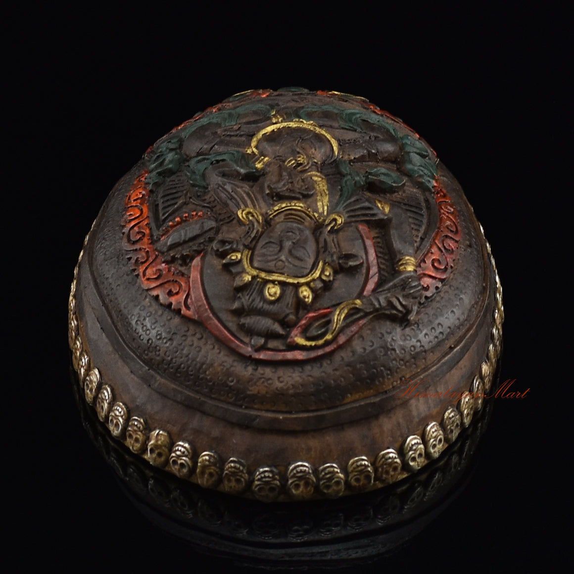 Top view of the Manjushri Carved Resin Kapala displaying the carved Manjushri figure and skull-border design