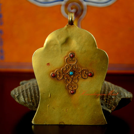 Back view of Manjushri Silver Pendant showing fine siko hand carving on gold-plated silver with traditional Tibetan Ghau craftsmanship.