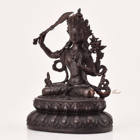 Left-side view of handcrafted Manjushri statue for sale, Tibetan Buddhist meditation and religious sculpture.