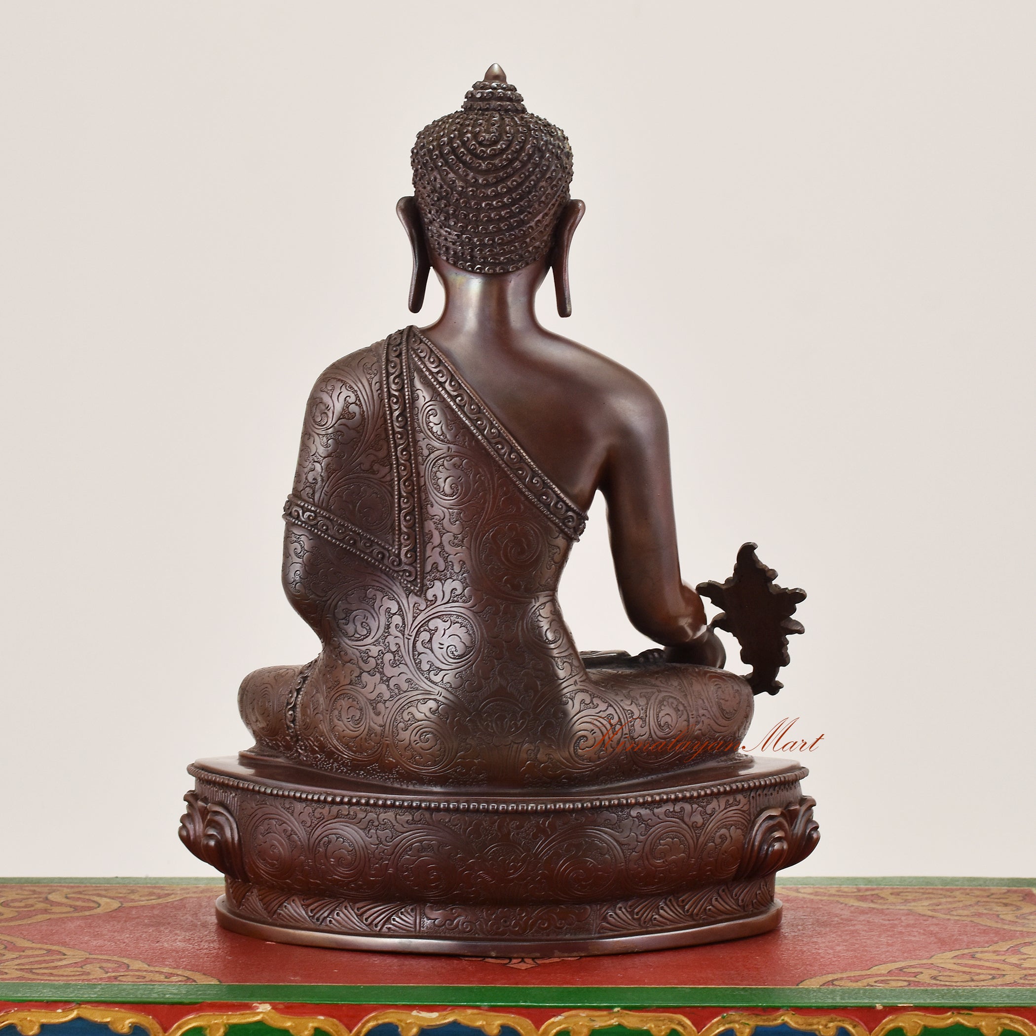 Back view of Medicine Buddha Idol sacred copper alloy statue displaying traditional sculptural detail and sacred design