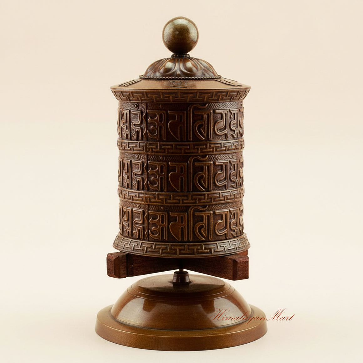 Meditation Tabletop Prayer Wheel handcrafted in copper, brass, and white metal on a wooden base, a sacred Buddhist mantra wheel for daily prayer and meditation.