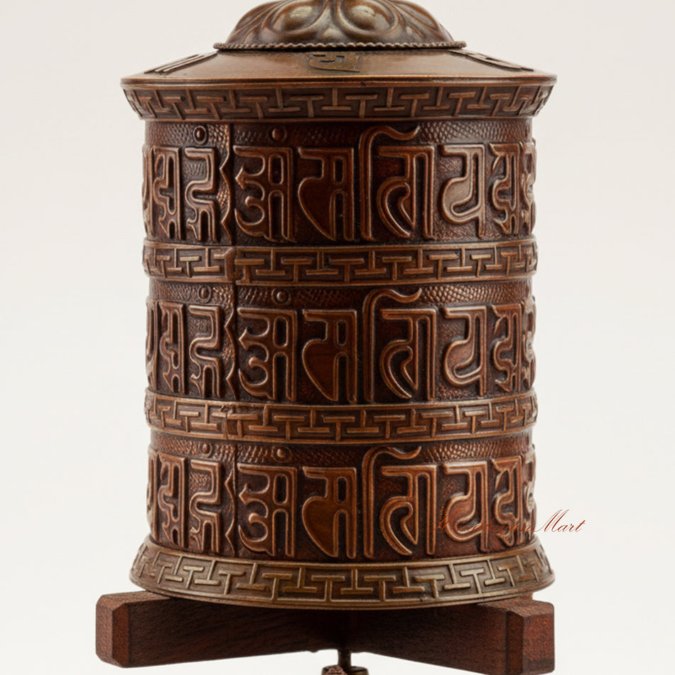 Close-up detail of the Meditation Tabletop Prayer Wheel showing engraved Buddhist mantras and decorative metalwork crafted in copper, brass, and white metal.