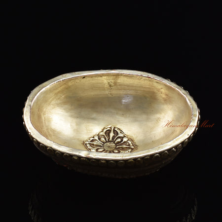 Angled top view of the Namtose Vaisravana Resin Kapala capturing the full carved figure and metal skull detailing