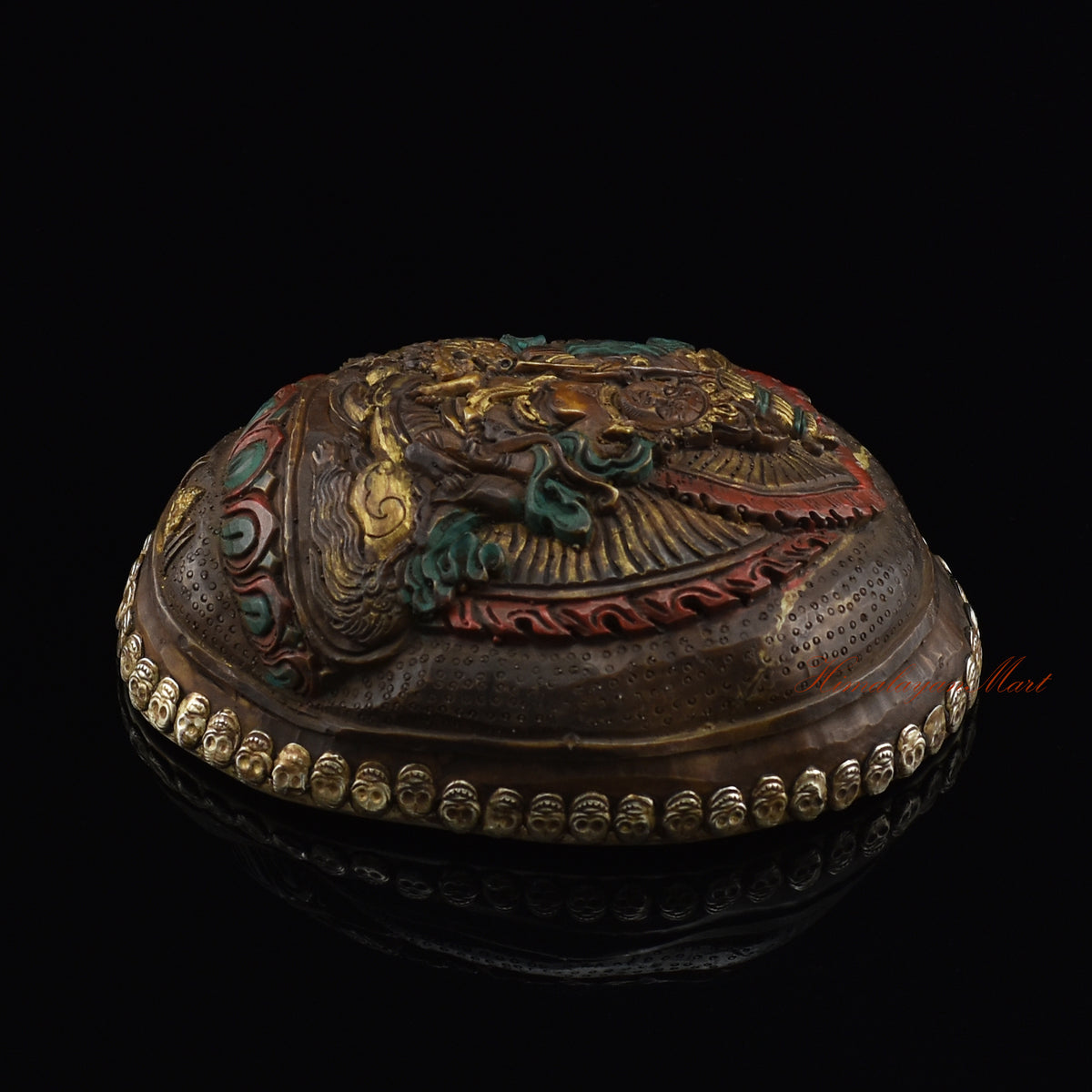Right side view of the Namtose Vaisravana Resin Kapala showing the hand-painted finish and skull border