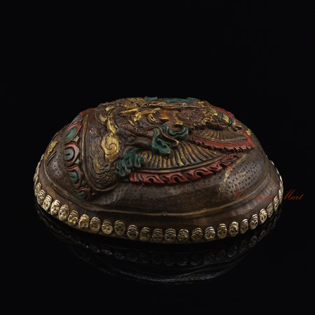 Right side view of the Namtose Vaisravana Resin Kapala showing the hand-painted finish and skull border