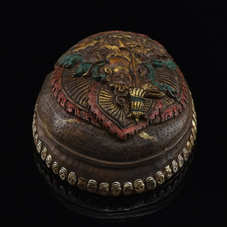 Top view of the Namtose Vaisravana Resin Kapala displaying the carved Vaisravana figure and skull-border design