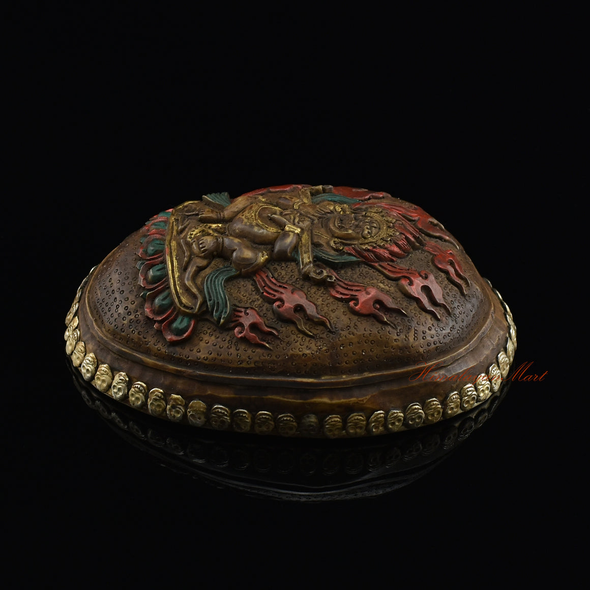 Right side view of the Panjarnata Mahakala Resin Kapala showing the hand-painted finish and skull border