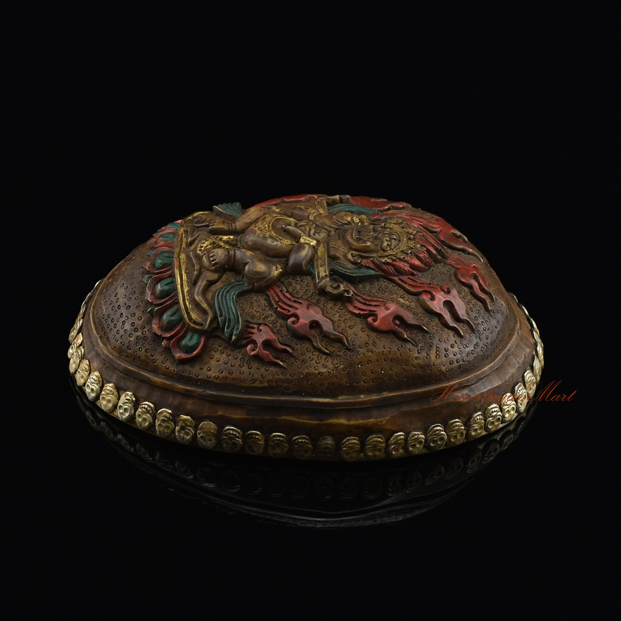 Right side view of the Panjarnata Mahakala Resin Kapala showing the hand-painted finish and skull border
