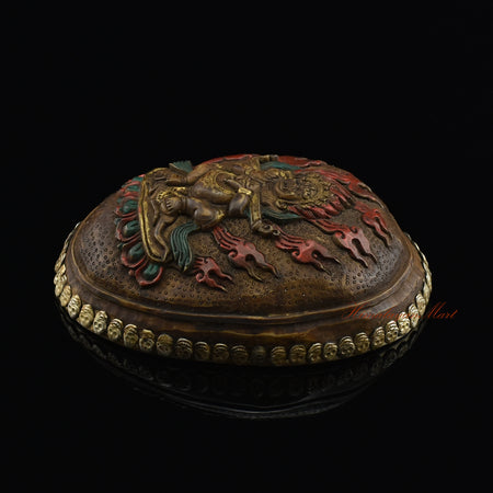 Right side view of the Panjarnata Mahakala Resin Kapala showing the hand-painted finish and skull border