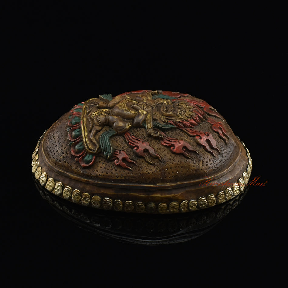 Right side view of the Panjarnata Mahakala Resin Kapala showing the hand-painted finish and skull border