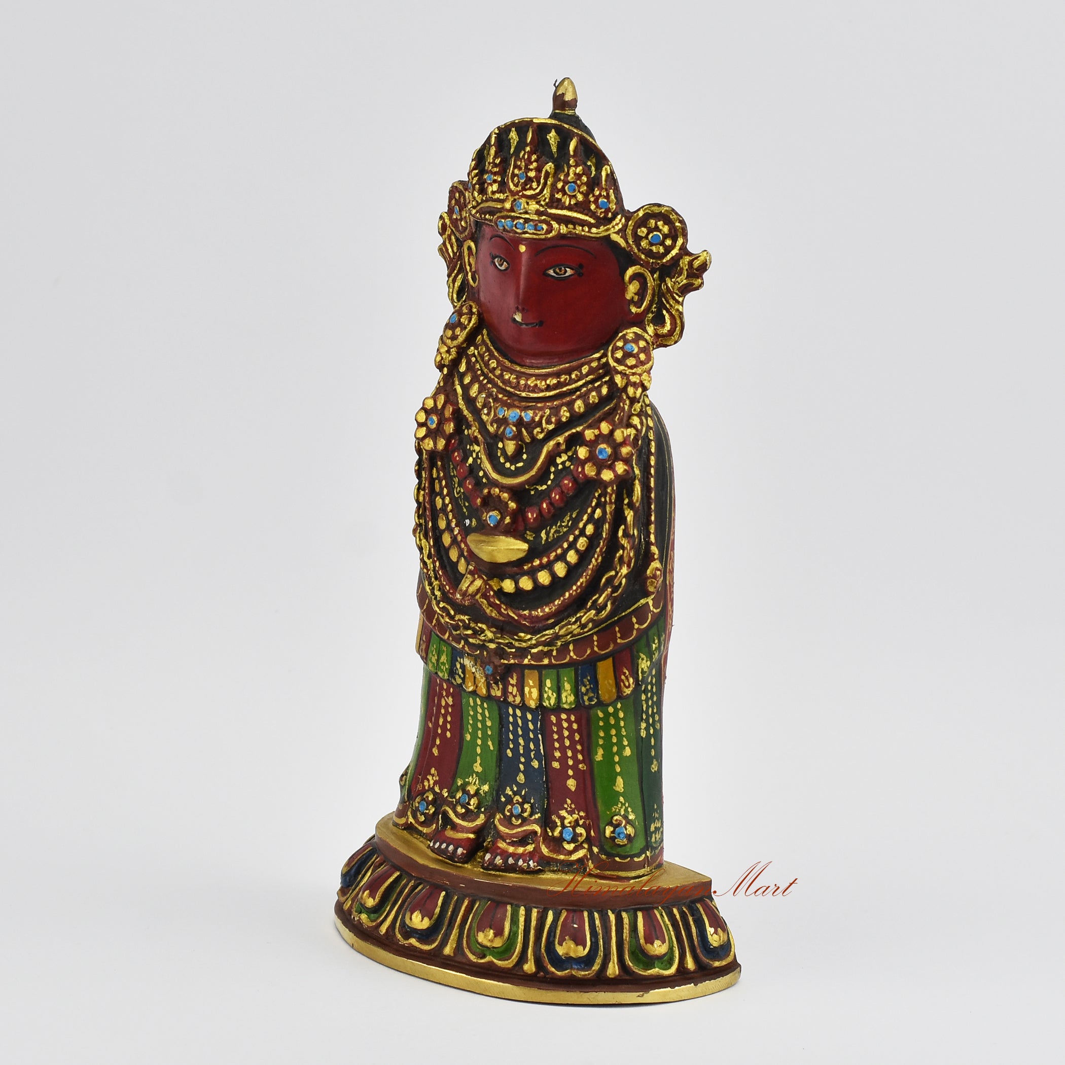 Left side view of a gold gilded Rato Machindranath Statue highlighting traditional Nepalese craftsmanship and form.