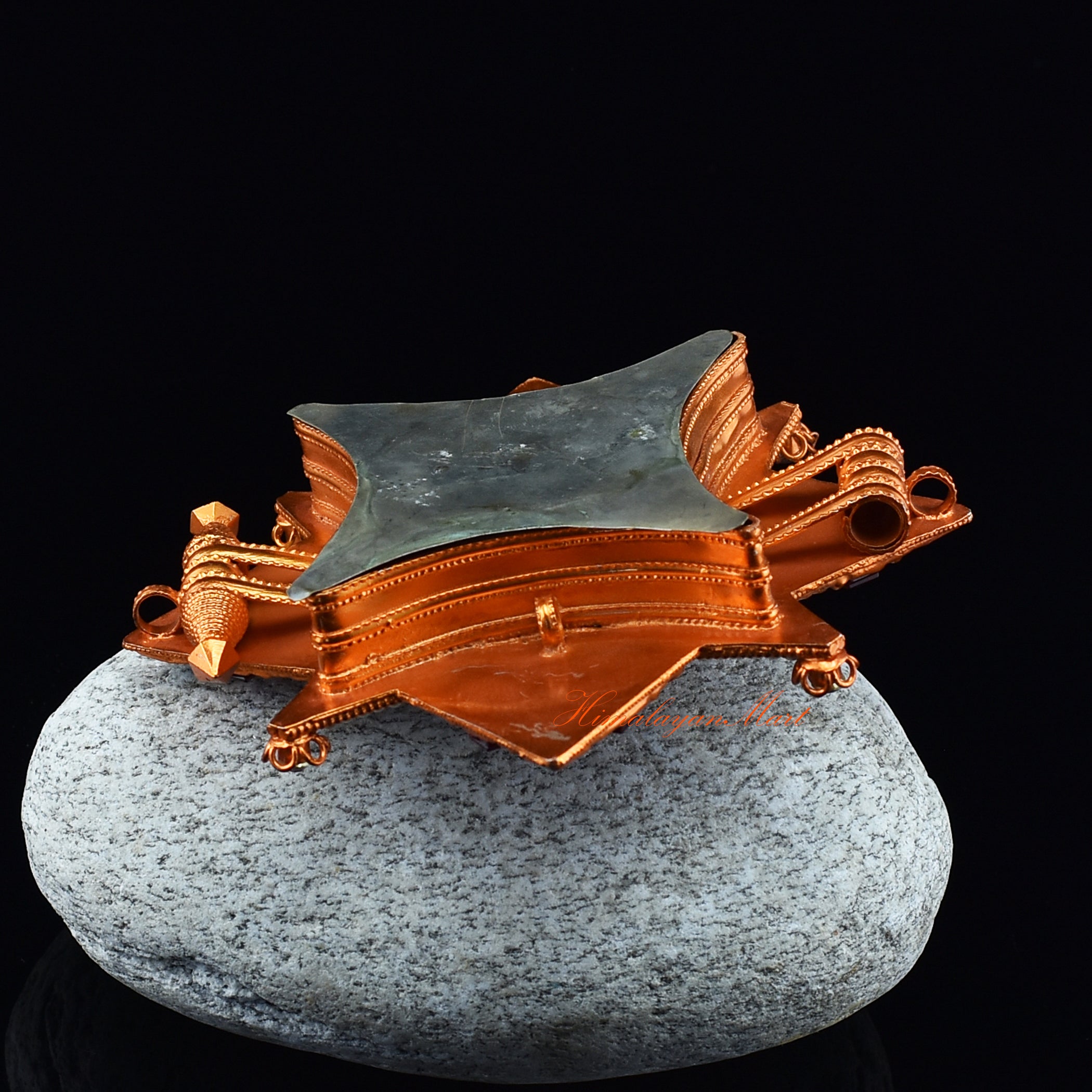 Bottom view of Religious Ghau Pendant showing smooth finish and finely detailed brass craftsmanship.