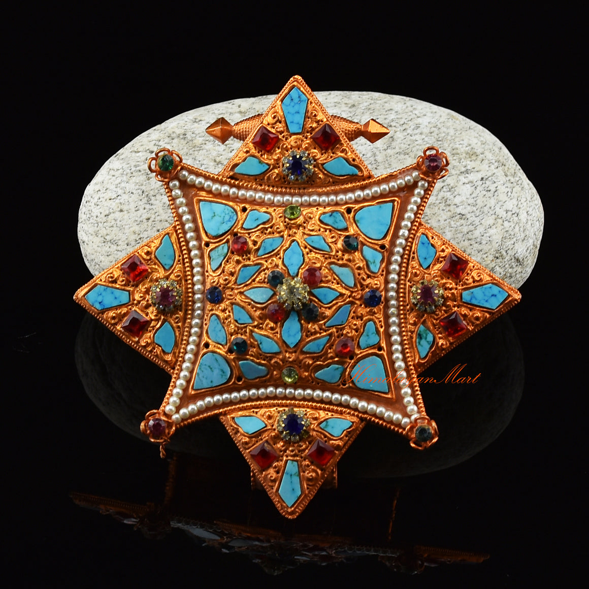 Front view of handcrafted Religious Ghau Pendant in brass with gold and silver plating and gemstones.