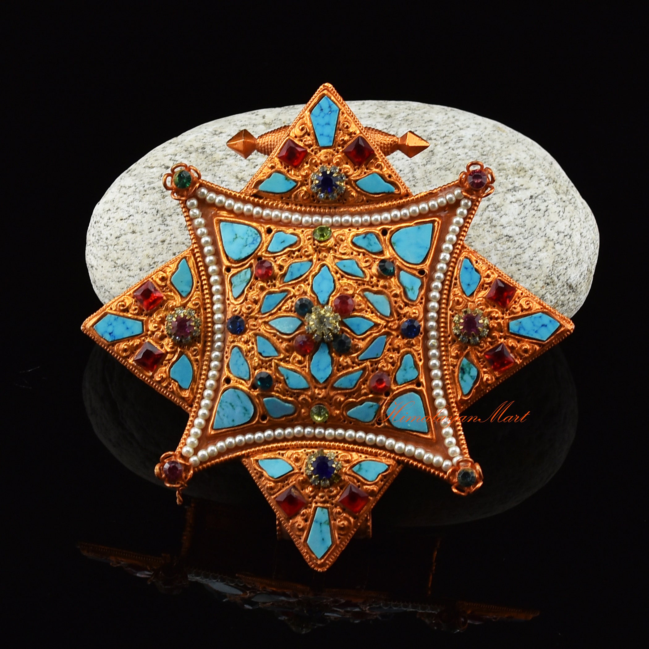 Front view of handcrafted Religious Ghau Pendant in brass with gold and silver plating and gemstones.