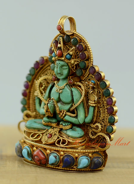 Left-side view of the Sacred Chenrezig Ghau Pendant highlighting the handcrafted metalwork and gemstone settings.