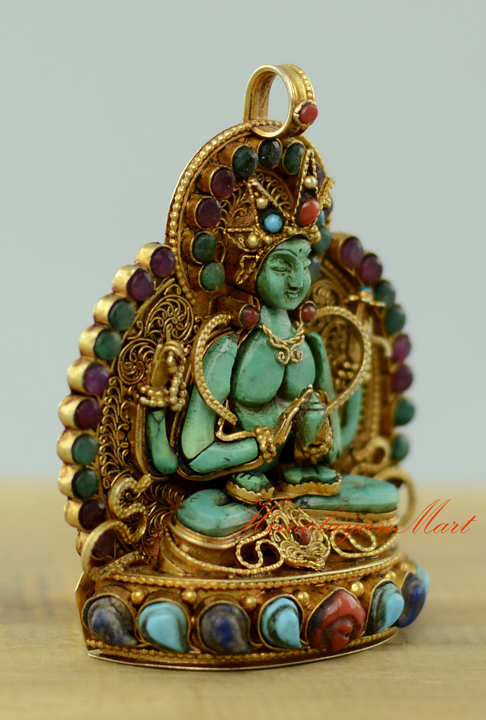 Right-side view of the Sacred Chenrezig Ghau Pendant showing detailed filigree carving and gold-plated accents.