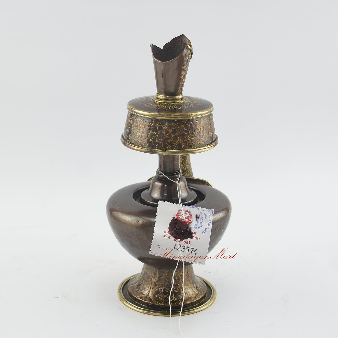 Back view of Sacred Traditional Bhumba showing hand-carved details on an oxidized copper ritual vase