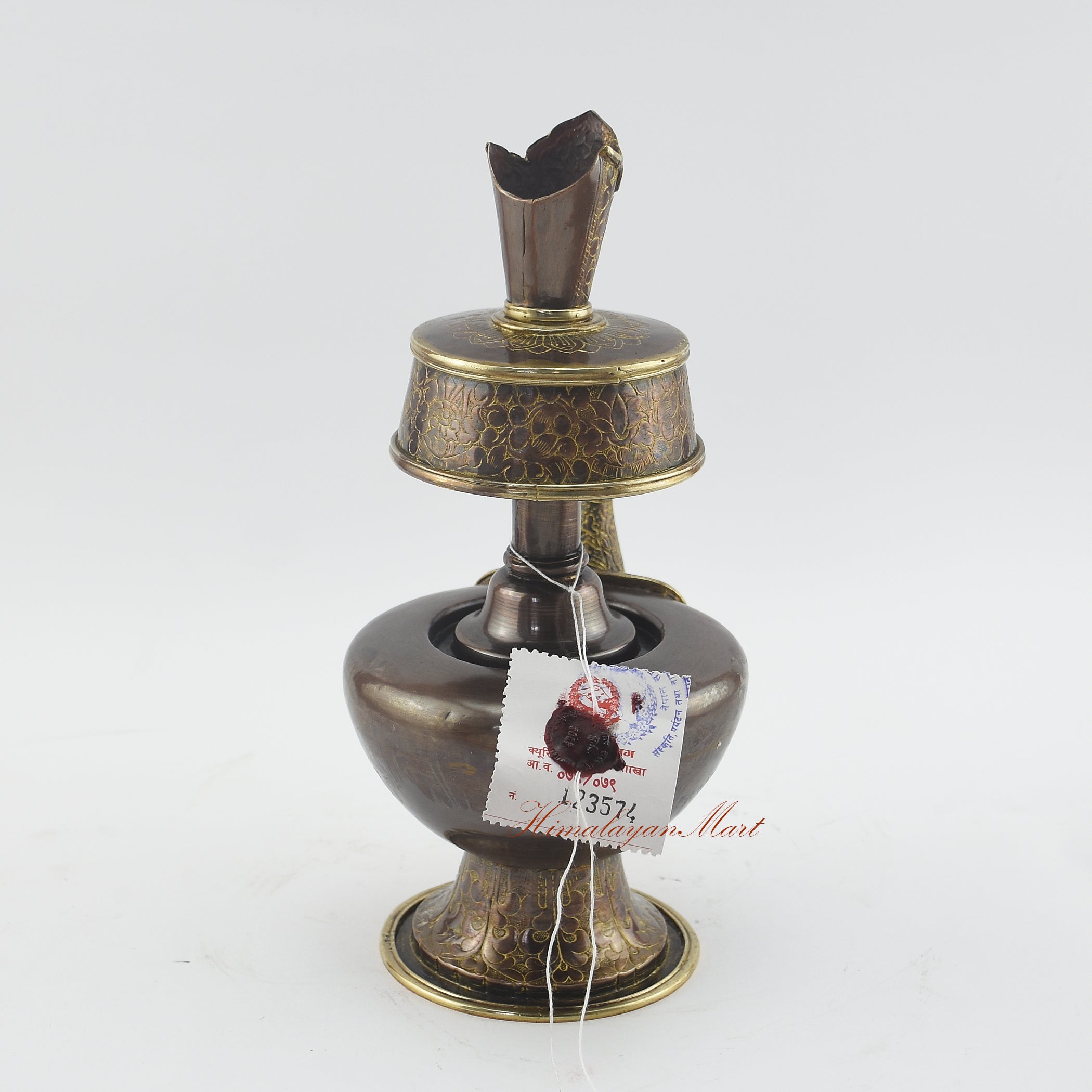 Back view of Sacred Traditional Bhumba showing hand-carved details on an oxidized copper ritual vase