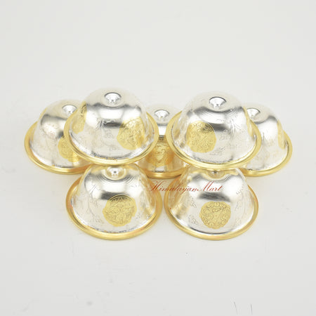 Angled upper view of Seven Tibetan Offering Bowls revealing intricate sacred patterns.