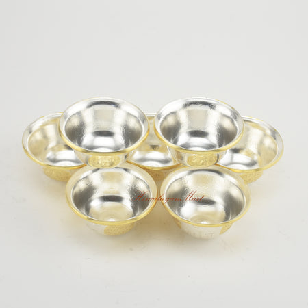 Upper perspective of Seven Tibetan Offering Bowls highlighting gold and silver plated finish.