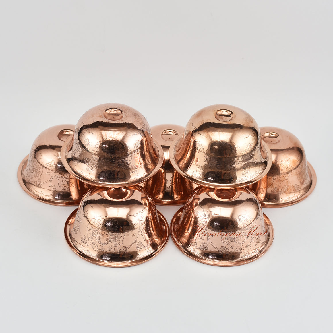 Angled view of Seven Water Offering Bowl Set displaying depth and craftsmanship of Tibetan bowls