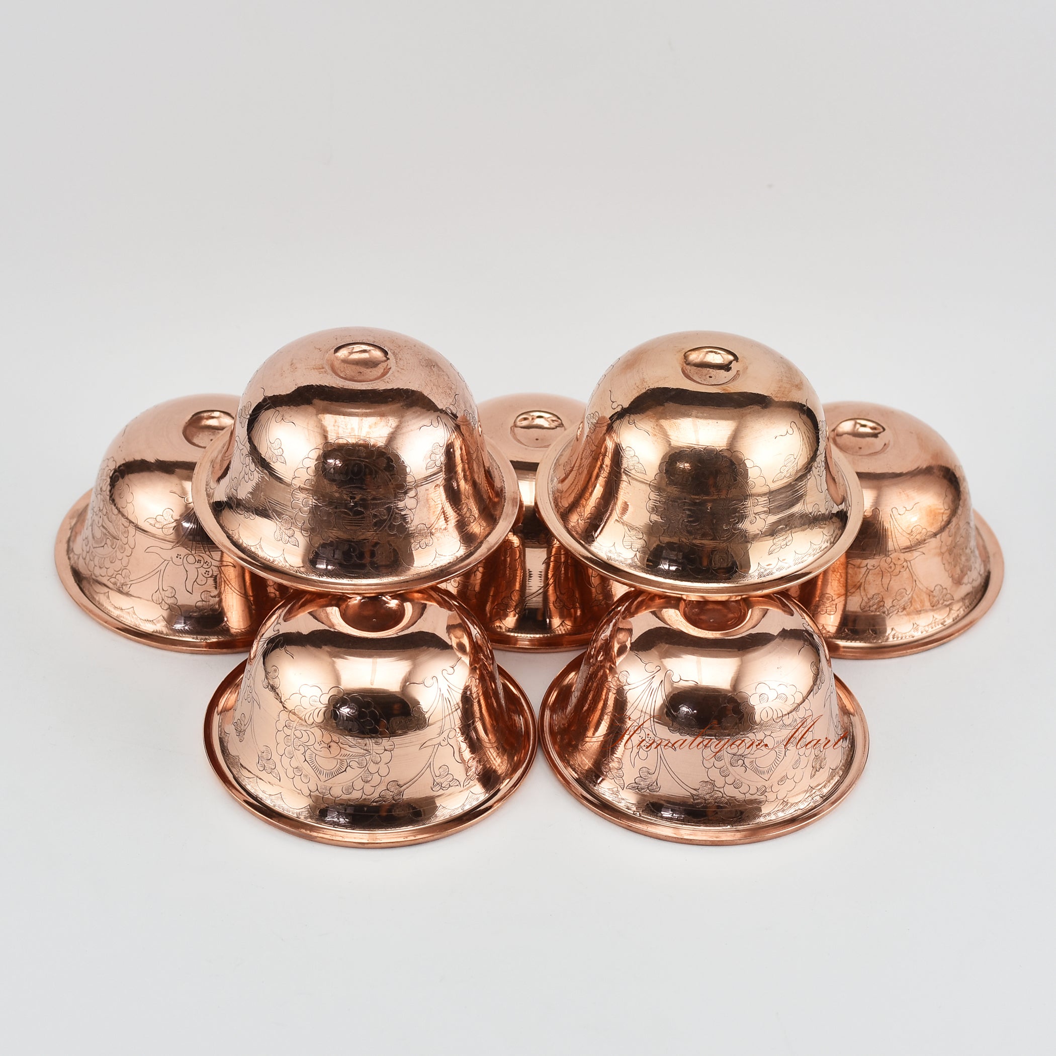 Angled view of Seven Water Offering Bowl Set displaying depth and craftsmanship of Tibetan bowls
