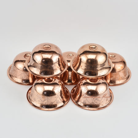 Angled view of Seven Water Offering Bowl Set displaying depth and craftsmanship of Tibetan bowls
