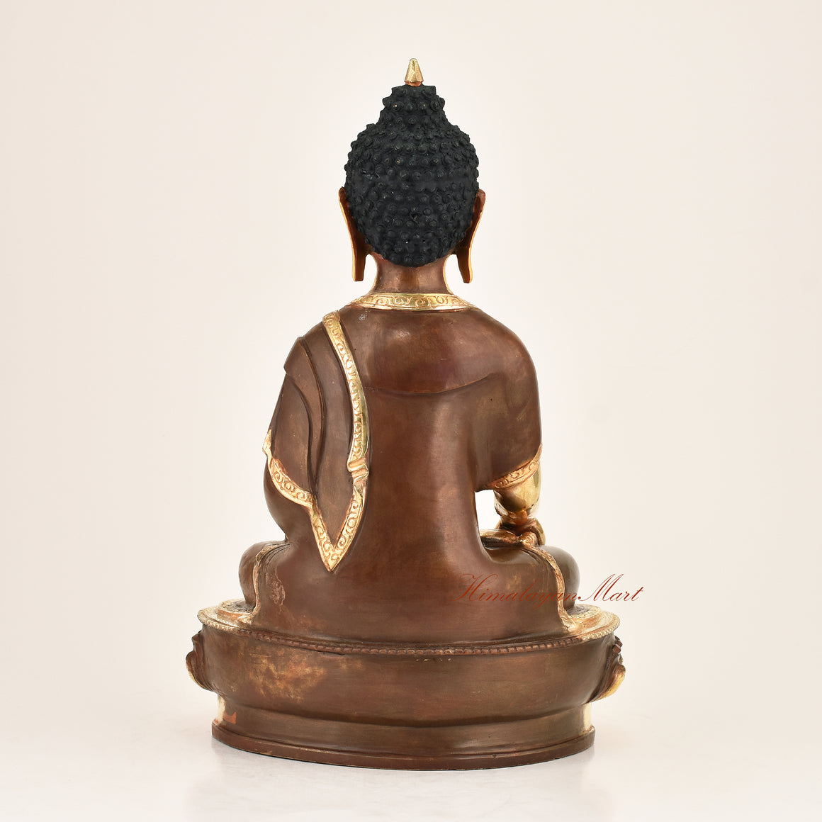 Back view of an authentic Shakyamuni Buddha copper alloy statue, gold-plated finish, handmade in Patan, Nepal
