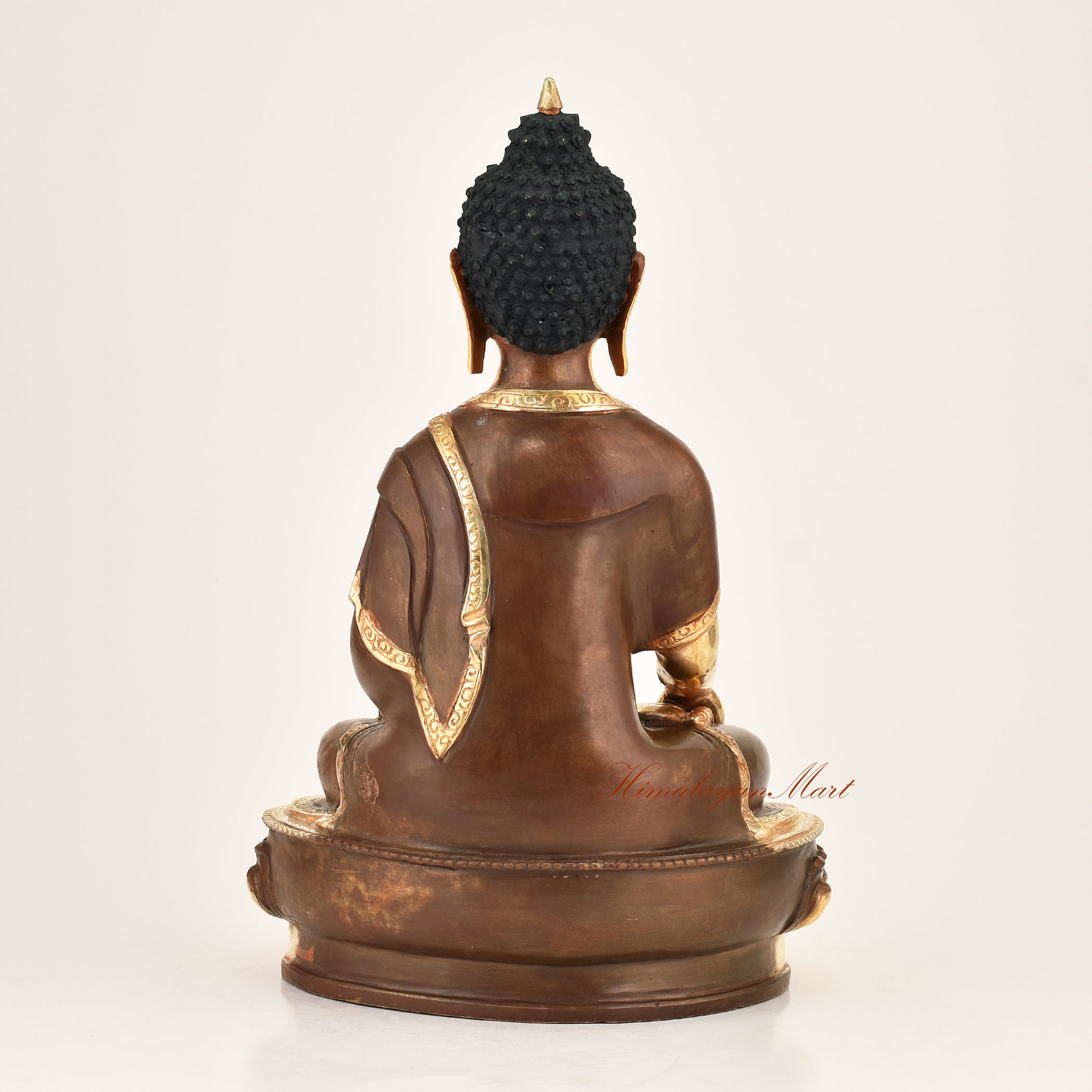 Back view of an authentic Shakyamuni Buddha copper alloy statue, gold-plated finish, handmade in Patan, Nepal