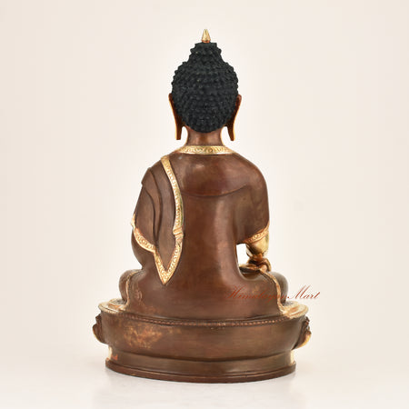 Back view of an authentic Shakyamuni Buddha copper alloy statue, gold-plated finish, handmade in Patan, Nepal