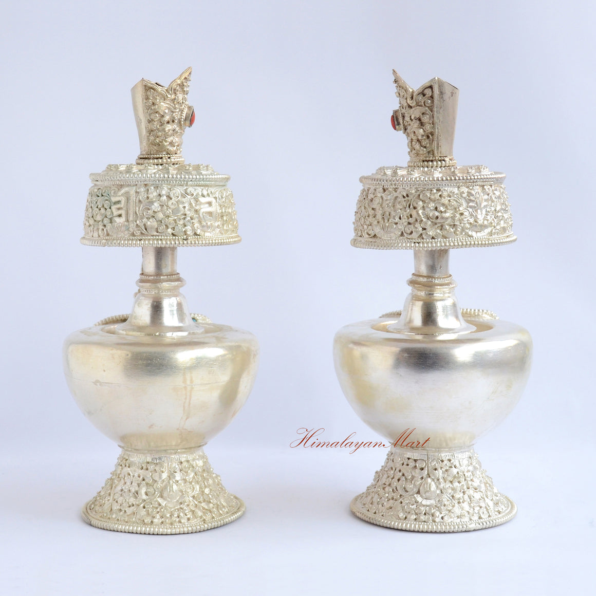 Back view of Silver-Plated Bhumba Ritual Set showing intricate hand-carved Buddhist motifs and silver-plated finish