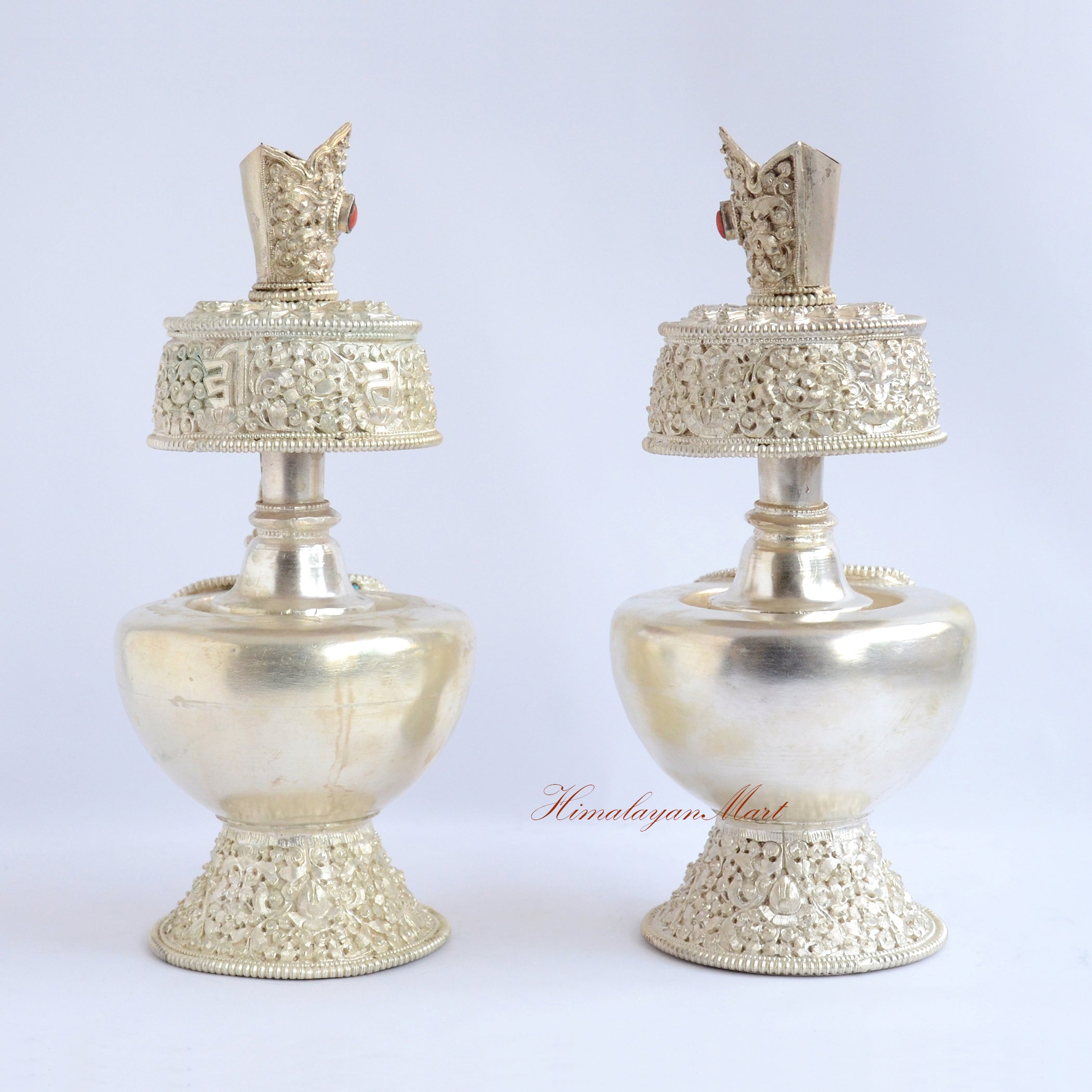 Back view of Silver-Plated Bhumba Ritual Set showing intricate hand-carved Buddhist motifs and silver-plated finish