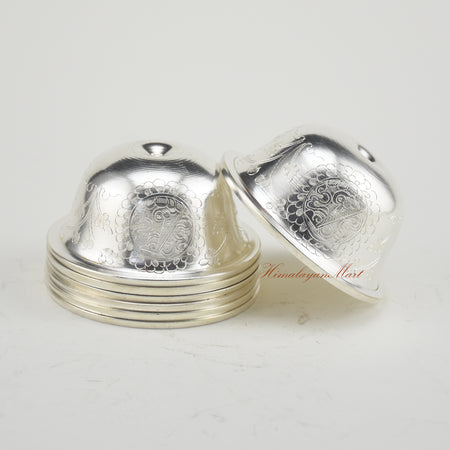 Side view of Silver-Plated Water Offering Bowls with traditional Buddhist carving details
