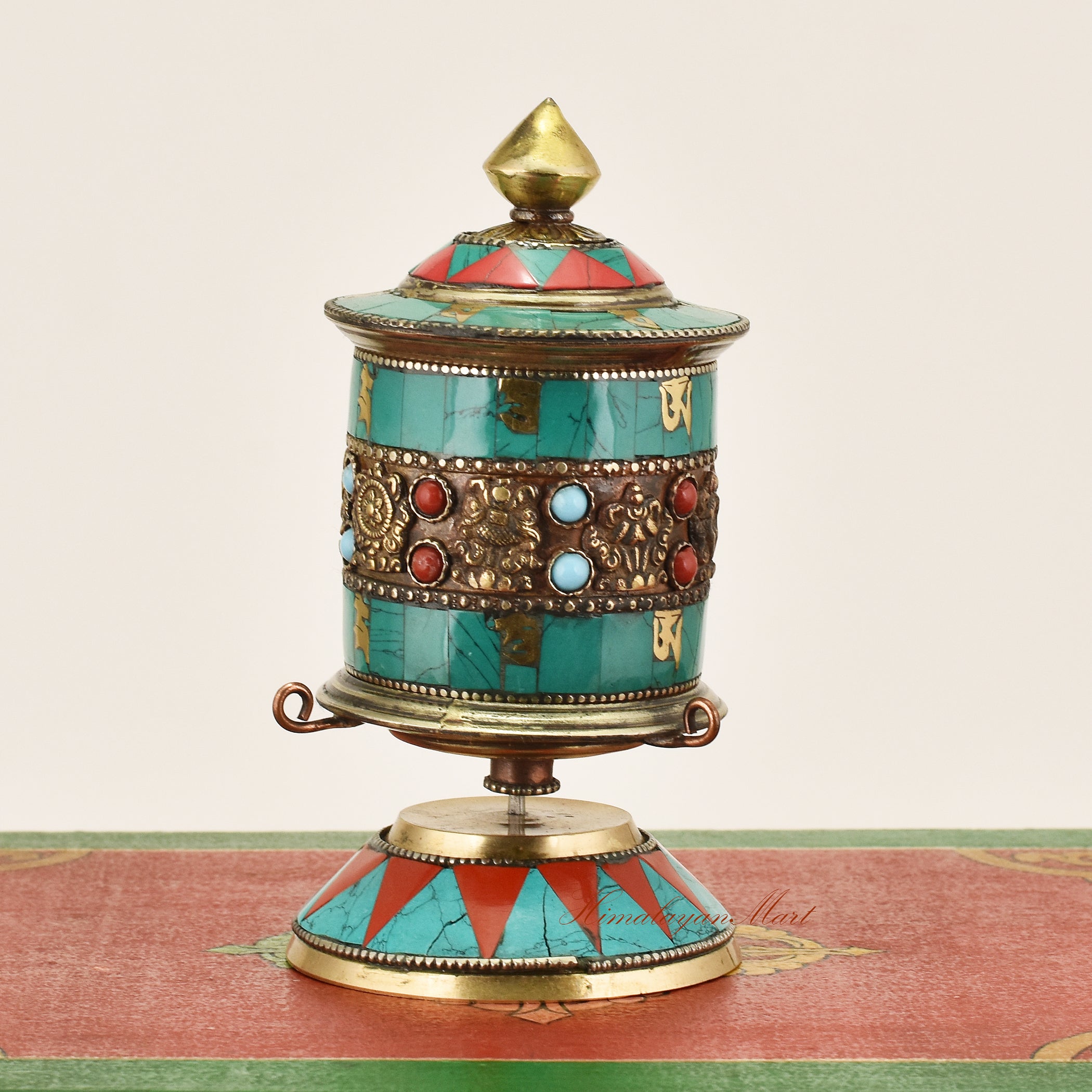 Side view of Small Tabletop Prayer Wheel – handcrafted Tibetan Buddhist ritual tool with decorative details.