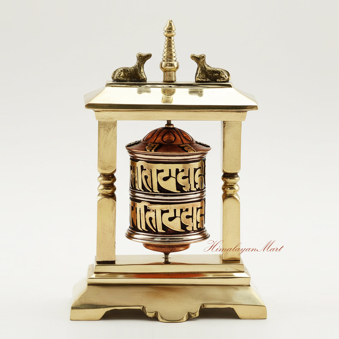 Handcrafted Table Top Prayer Wheel in brass and white metal, featuring a central stupa and deer, ideal for meditation, ritual, and spiritual decor.
