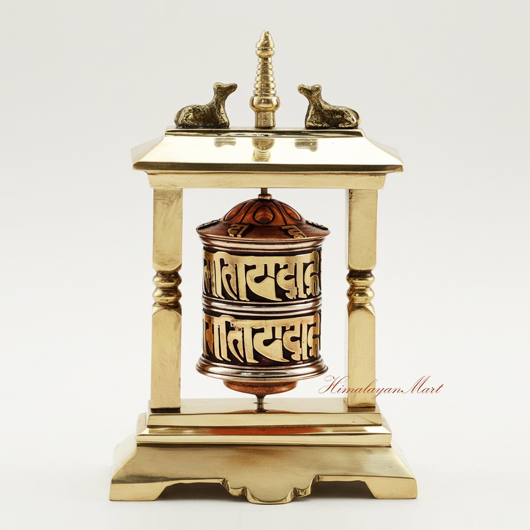 Handcrafted Table Top Prayer Wheel in brass and white metal, featuring a central stupa and deer, ideal for meditation, ritual, and spiritual decor.
