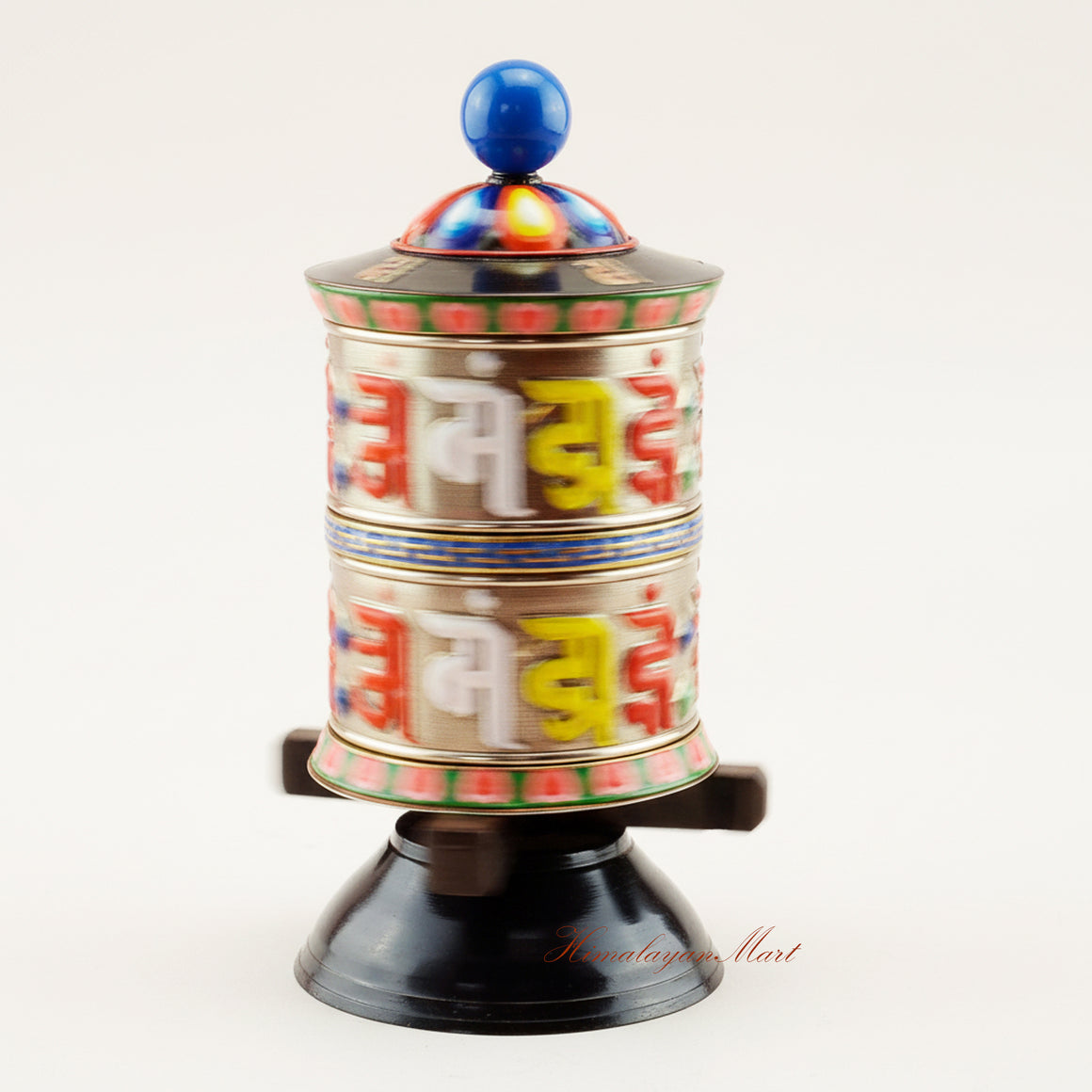 Handcrafted Tabletop Prayer Wheel spinning during Buddhist prayer ritual, symbolizing meditation, blessings, and spiritual devotion