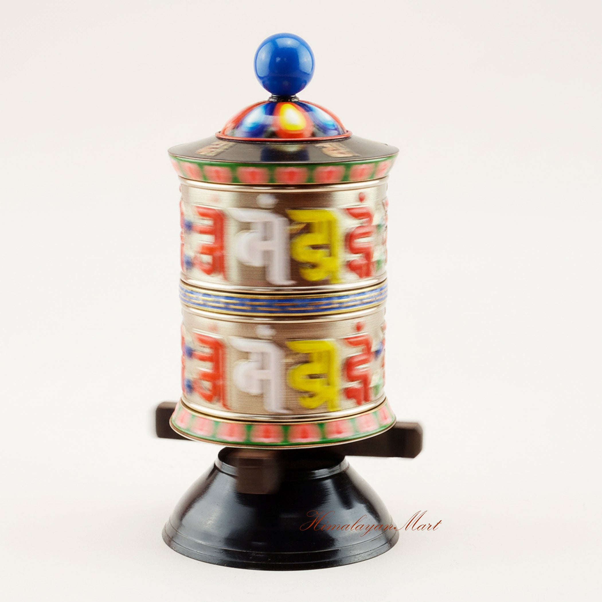 Handcrafted Tabletop Prayer Wheel spinning during Buddhist prayer ritual, symbolizing meditation, blessings, and spiritual devotion